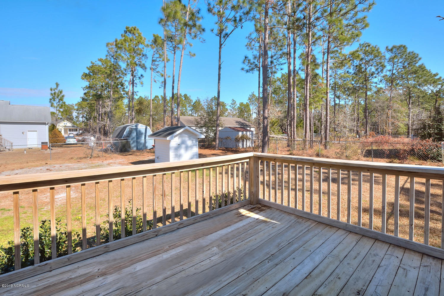 70 Greensboro Road Southport, NC 28461 - Photo 19 of 24 Back Deck and fenced yard