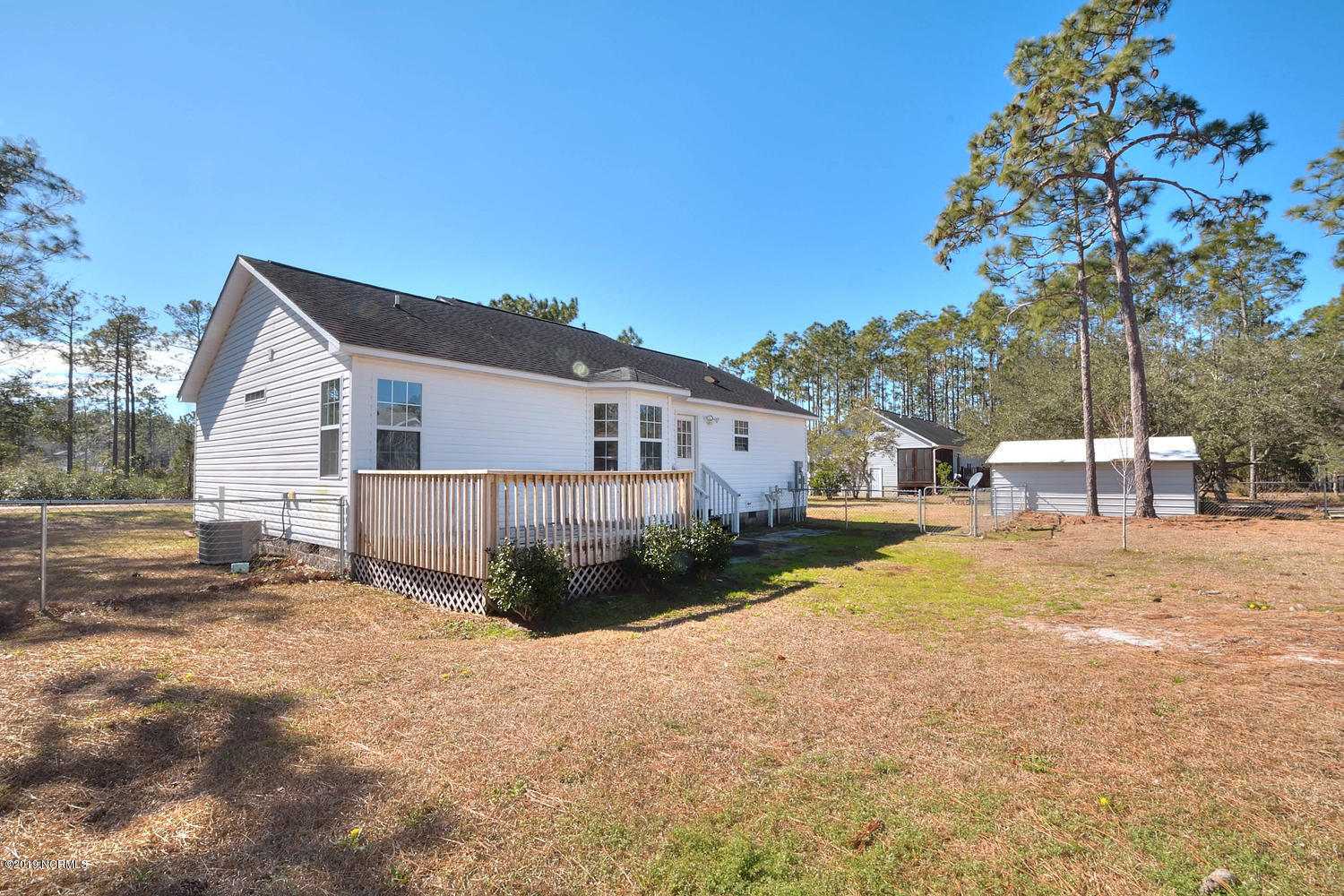 70 Greensboro Road Southport, NC 28461 - Photo 20 of 24 Back deck, patio fenced yard