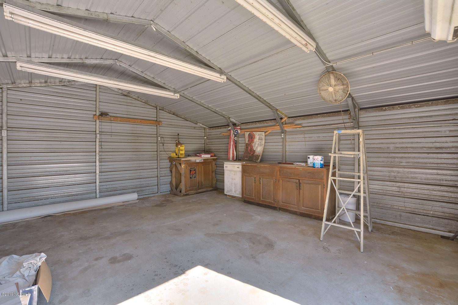 70 Greensboro Road Southport, NC 28461 - Photo 22 of 24 Plenty of lighting, outlets throughout, roll up door