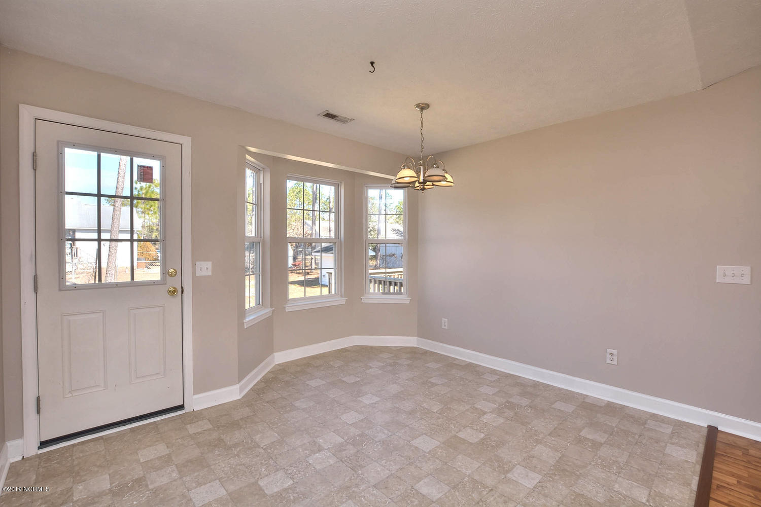 70 Greensboro Road Southport, NC 28461 - Photo 6 of 24 Dining Room and back door to patio