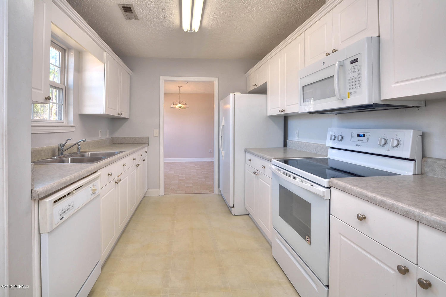 70 Greensboro Road Southport, NC 28461 - Photo 9 of 24 Kitchen with new stove and new microwave