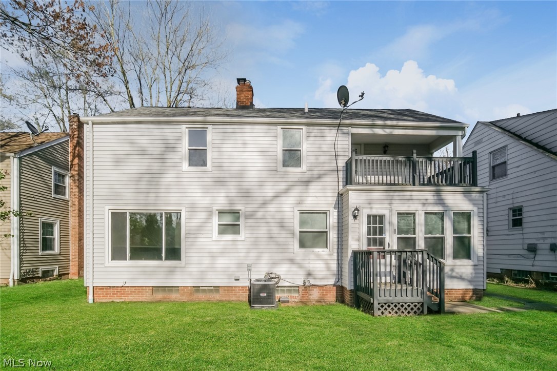 736 Quilliams Road Cleveland Heights, OH 44121 - Photo 20 of 20 Back of property with central air condition unit, a yard, and a balcony