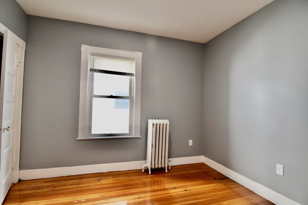 21 Treadway Road, Unit 2 Boston, MA 02125 - Photo 10 of 21 a view of empty room with wooden floor
