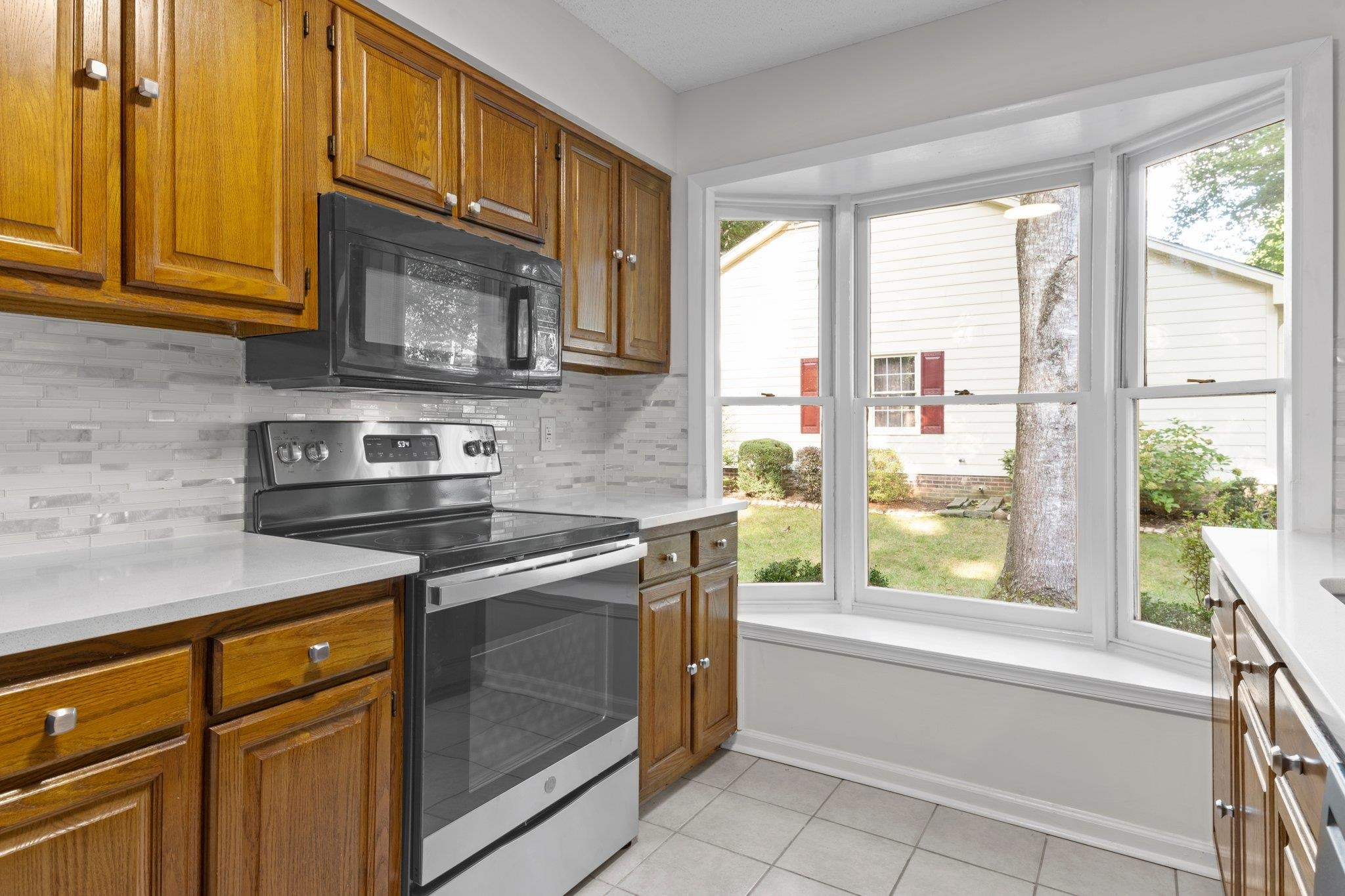 2638 Cottage Circle Raleigh, NC 27613 - Photo 4 of 24 New quartz counters designer tile backsplash!