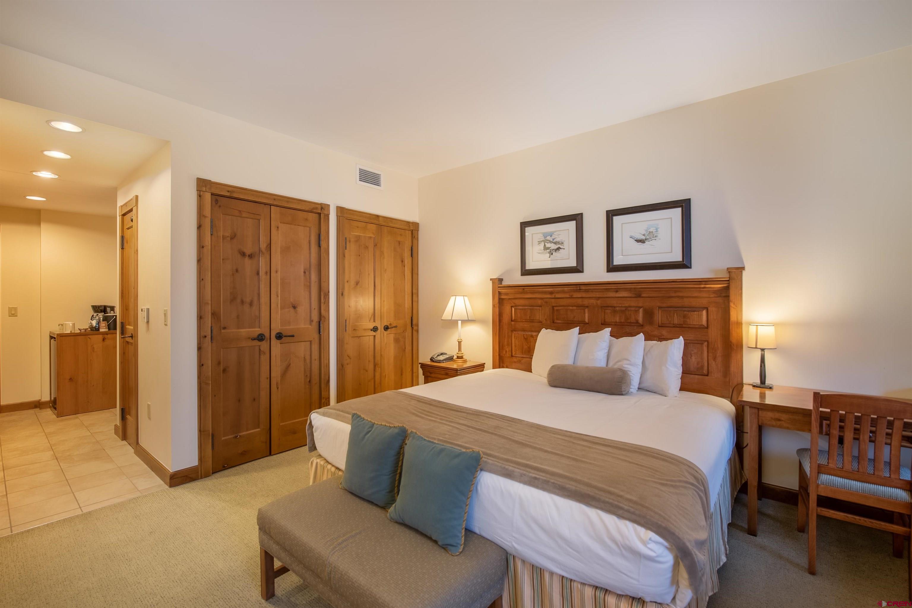 620 Gothic Road, Unit 504 Crested Butte, CO 81225 - Photo 14 of 33 a bedroom with a bed and a couch