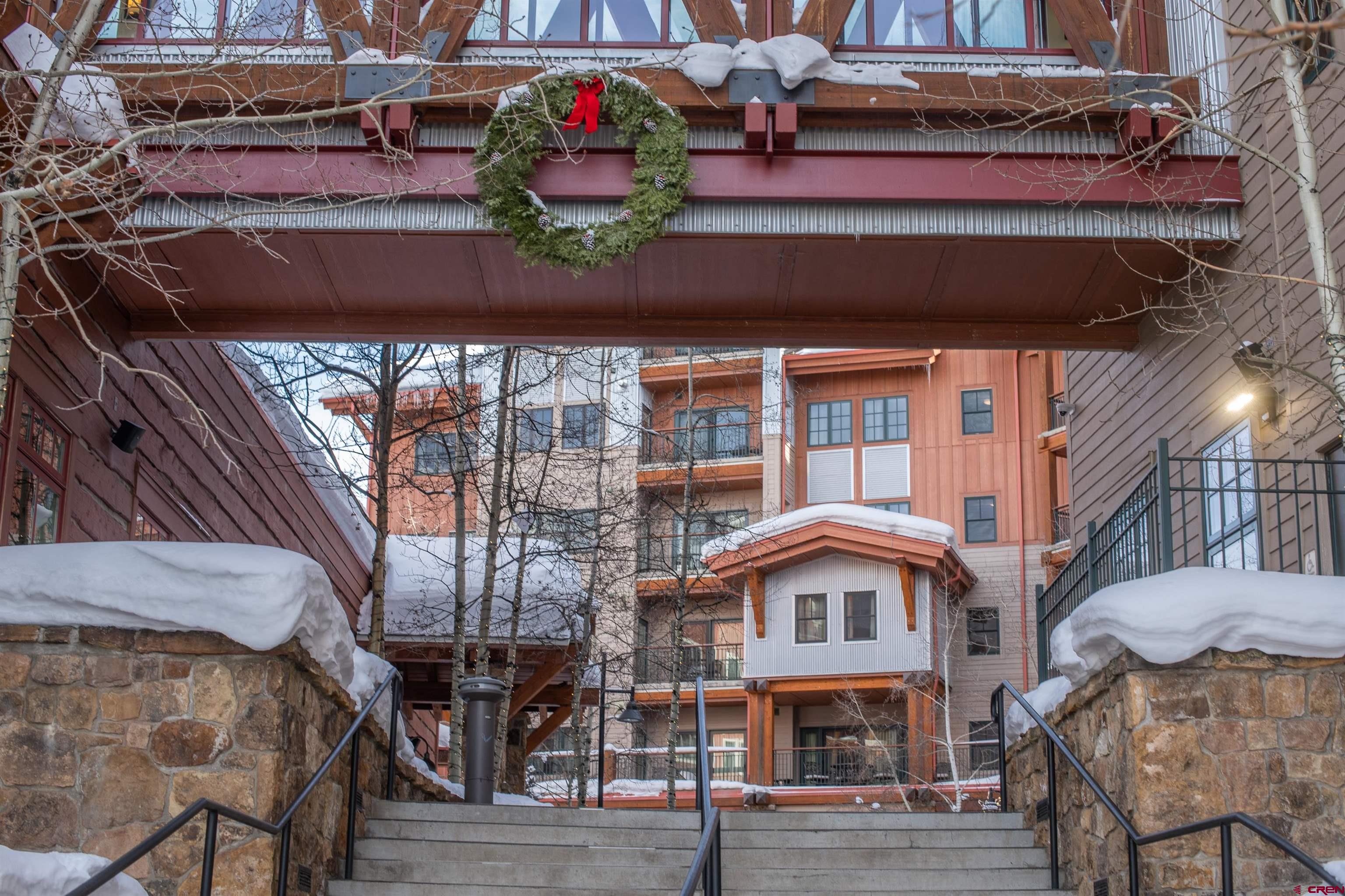 620 Gothic Road, Unit 504 Crested Butte, CO 81225 - Photo 26 of 33 a front view of a house with many windows