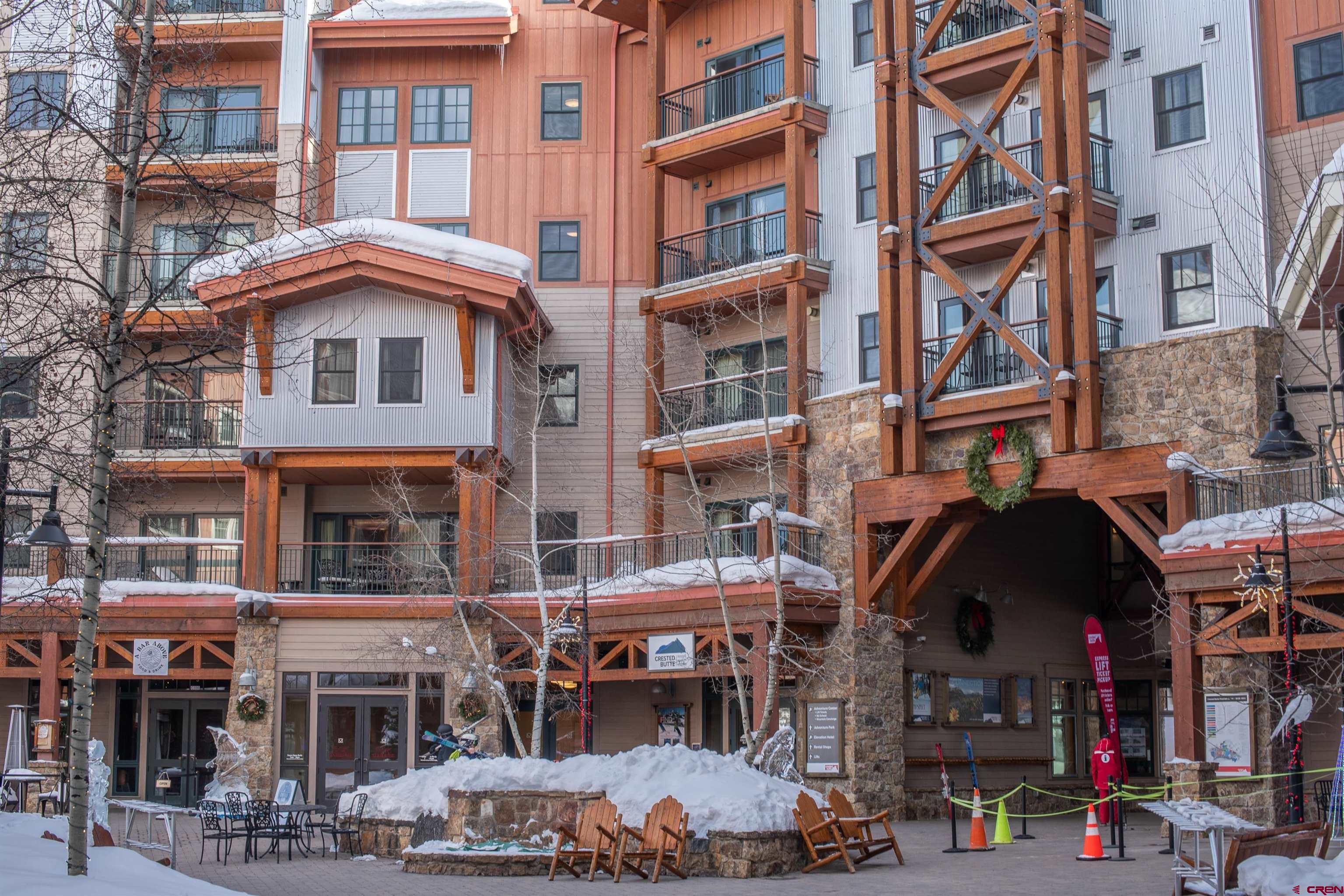 620 Gothic Road, Unit 504 Crested Butte, CO 81225 - Photo 27 of 33 a view of a building and a cars park in front of building