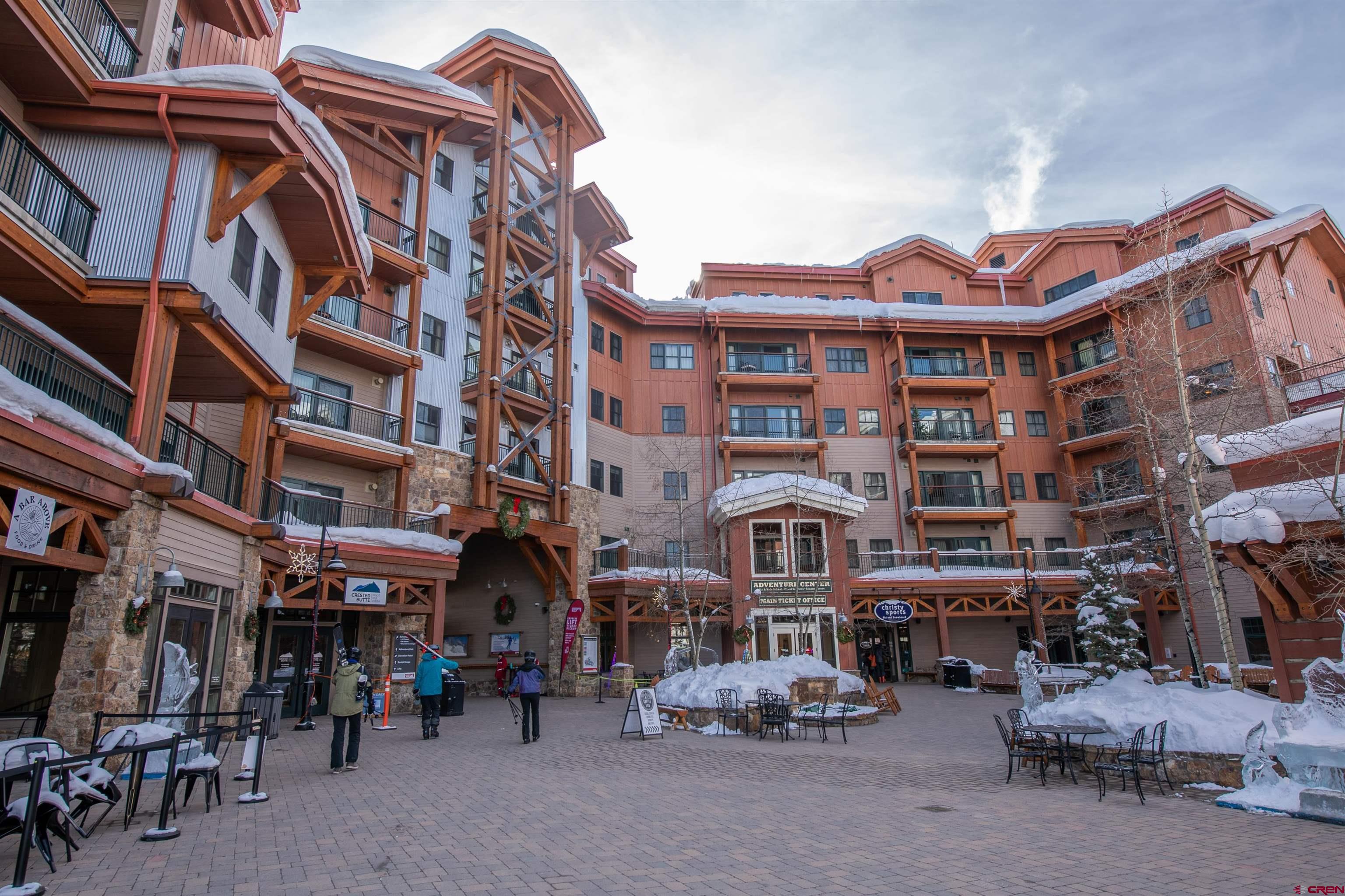 620 Gothic Road, Unit 504 Crested Butte, CO 81225 - Photo 28 of 33 a view of a building with a lot of cars parked