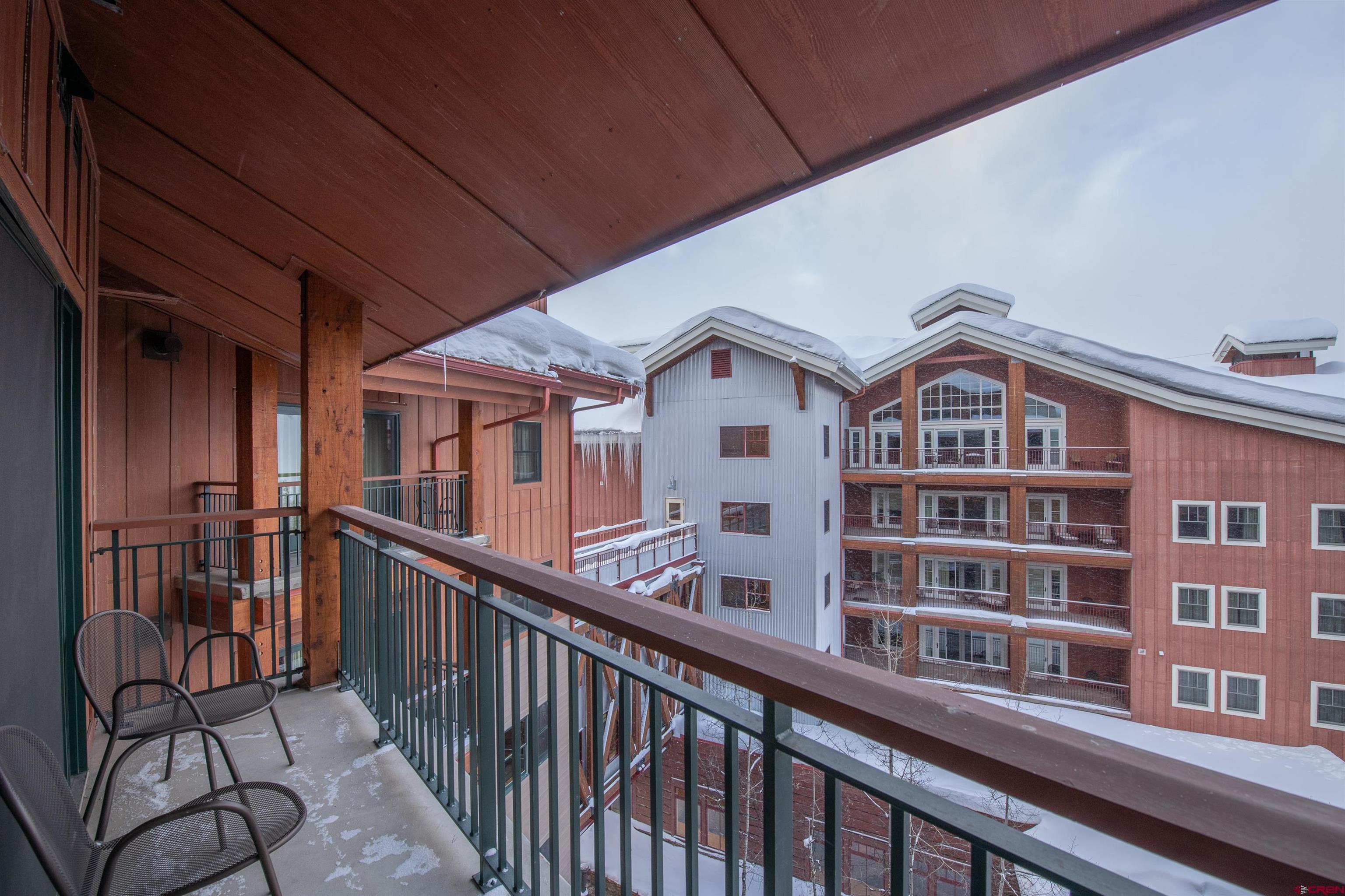 620 Gothic Road, Unit 504 Crested Butte, CO 81225 - Photo 9 of 33 a view of a brick building next to a yard
