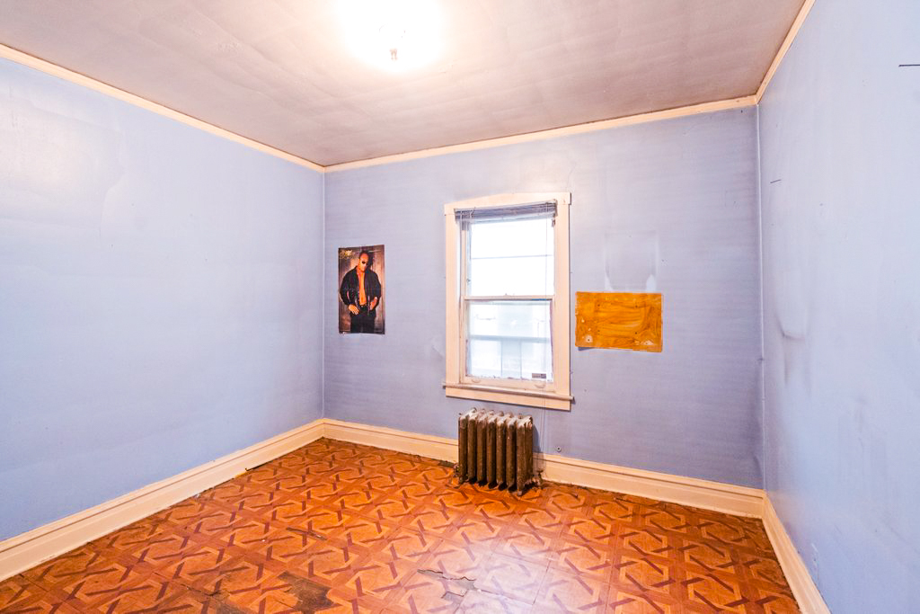 1627 North Long Avenue Chicago, IL 60639 - Photo 12 of 36 a view of a bedroom with a window