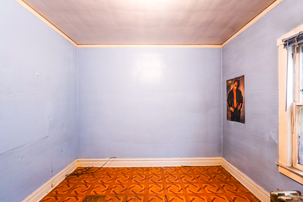 1627 North Long Avenue Chicago, IL 60639 - Photo 13 of 36 a view of a room with wooden floor and window