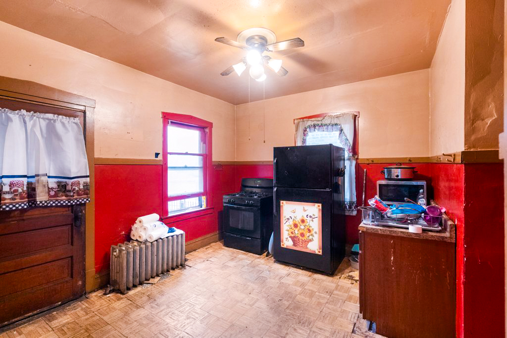 1627 North Long Avenue Chicago, IL 60639 - Photo 14 of 36 a bedroom with furniture and a flat screen tv