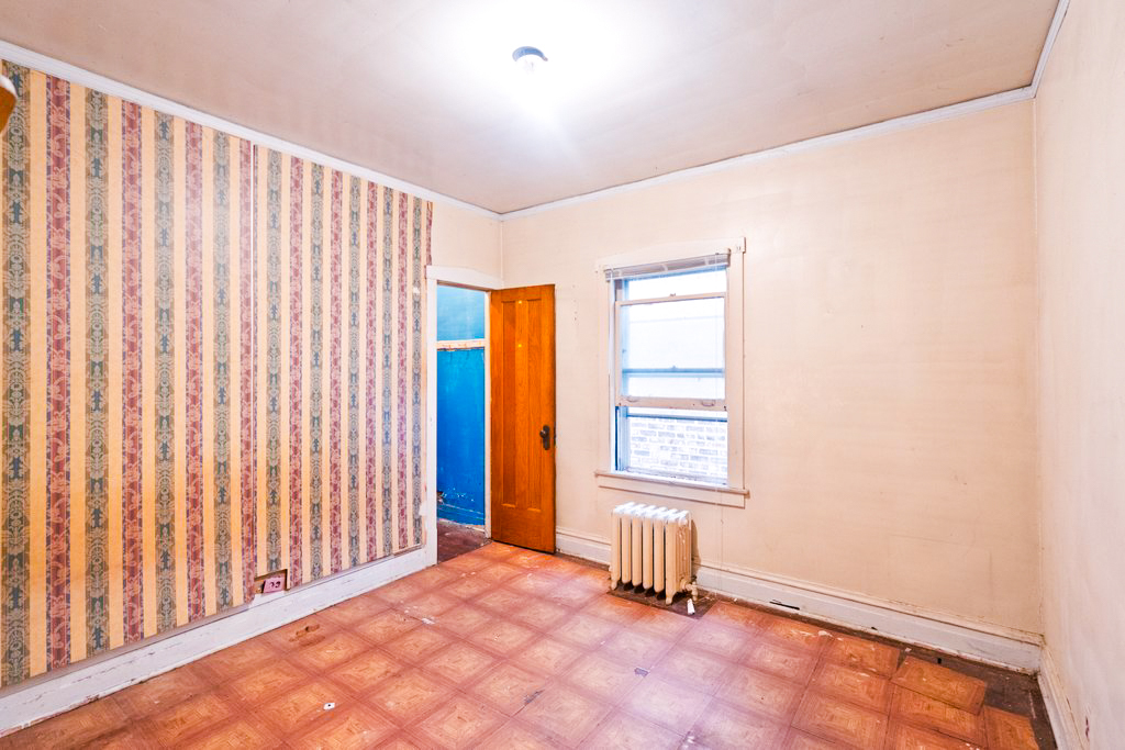 1627 North Long Avenue Chicago, IL 60639 - Photo 9 of 36 a view of an empty room with a window