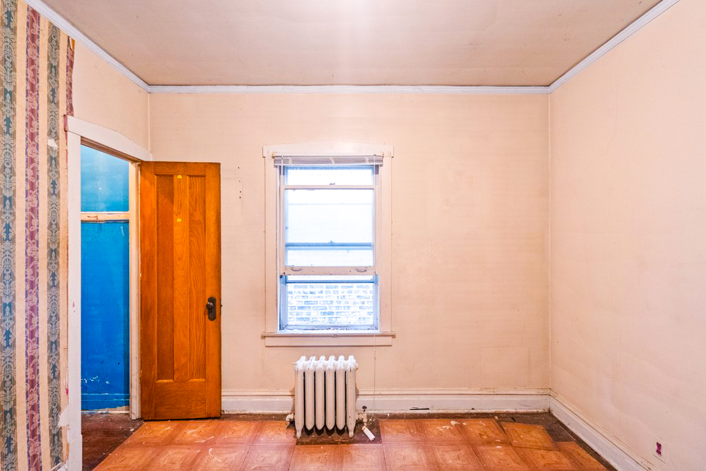 1627 North Long Avenue Chicago, IL 60639 - Photo 10 of 36 a view of an empty room with a window