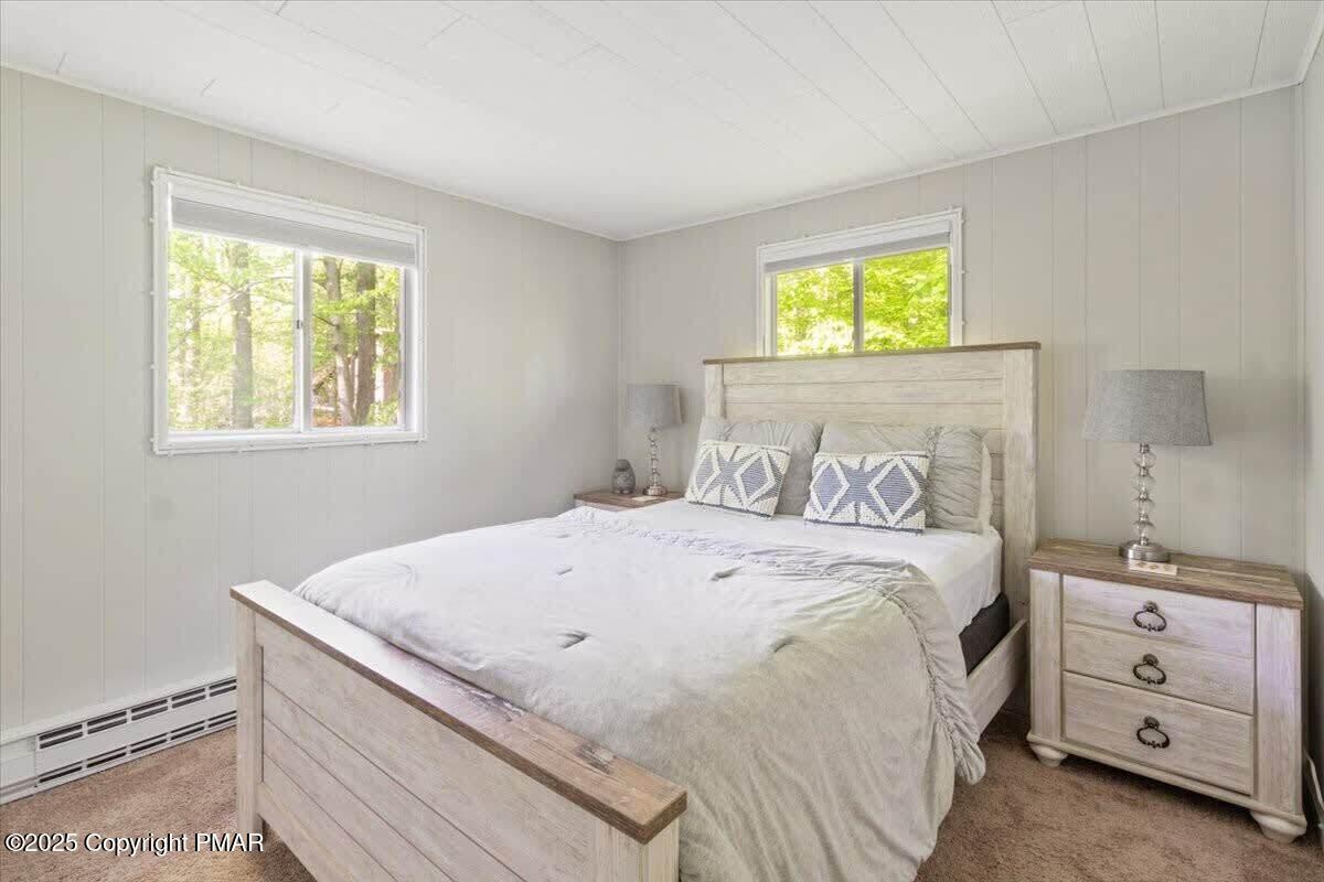 102 Sweet Briar Road Pocono Pines, PA 18350 - Photo 12 of 21 a bedroom with a bed and a window