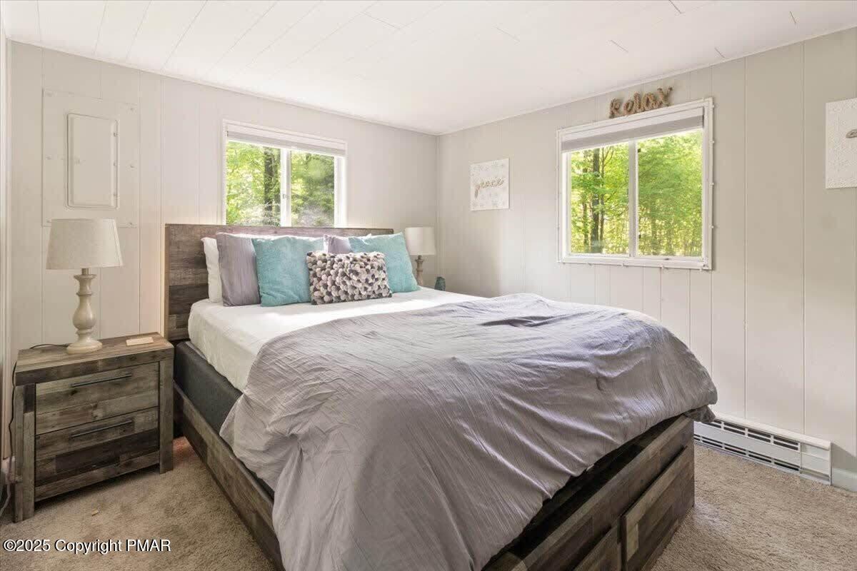 102 Sweet Briar Road Pocono Pines, PA 18350 - Photo 13 of 21 a bedroom with a bed and a window