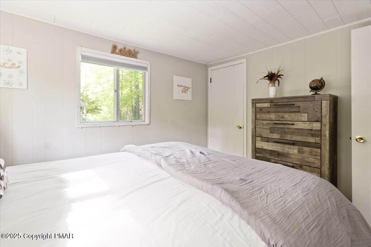 102 Sweet Briar Road Pocono Pines, PA 18350 - Photo 15 of 21 a bedroom with a bed and a window