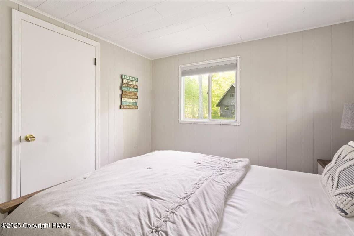 102 Sweet Briar Road Pocono Pines, PA 18350 - Photo 16 of 21 a bedroom with a bed and a window