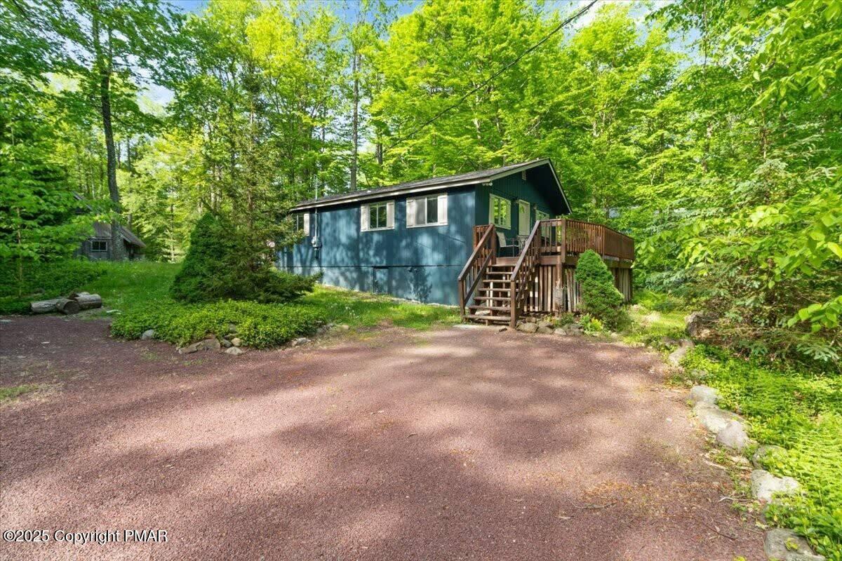 102 Sweet Briar Road Pocono Pines, PA 18350 - Photo 18 of 21 a view of a wooden house with large trees