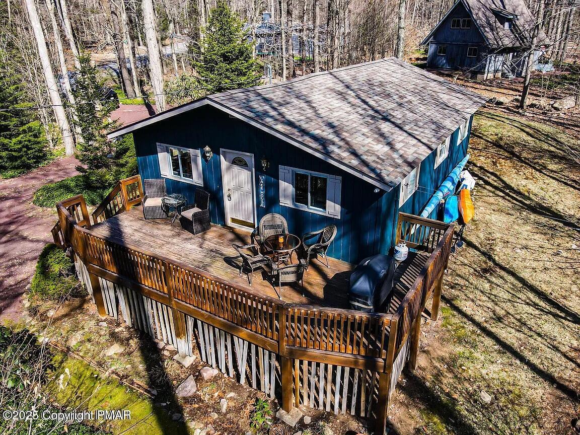 102 Sweet Briar Road Pocono Pines, PA 18350 - Photo 3 of 21 a view of a house with patio and wooden floor