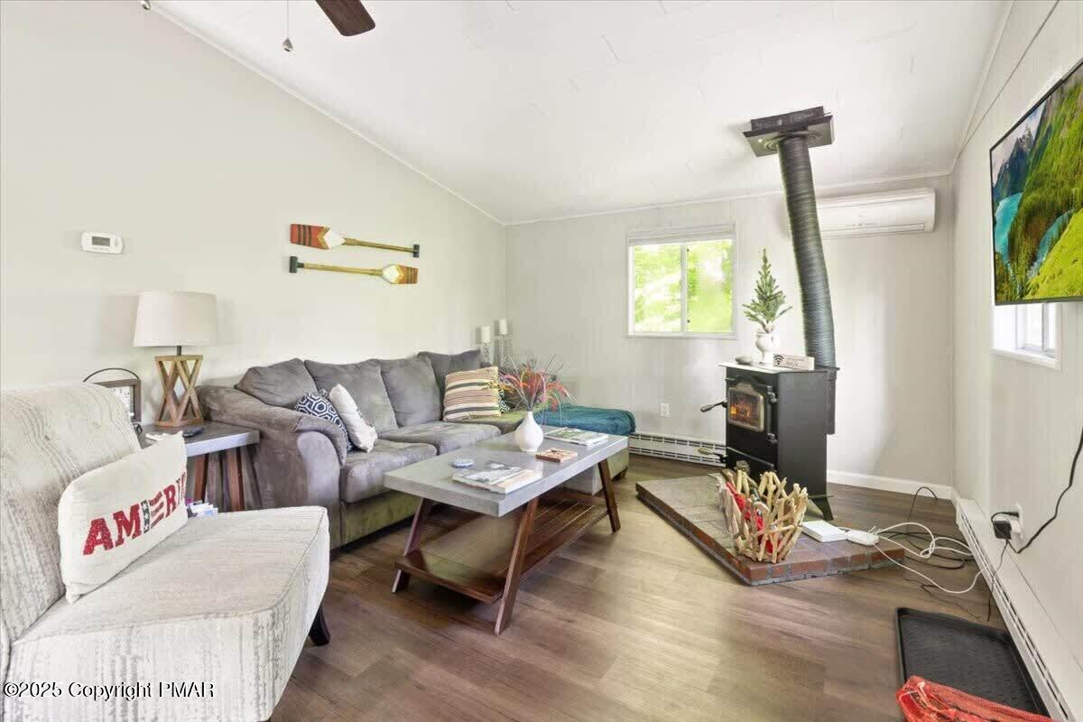 102 Sweet Briar Road Pocono Pines, PA 18350 - Photo 6 of 21 a living room with furniture a window and a flat screen tv