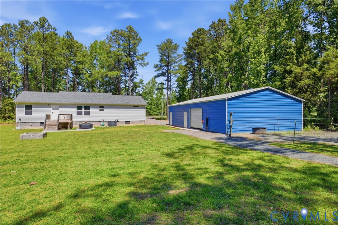 93 Faraway Road Saluda, VA 23149 - Photo 37 of 58 a view of a yard in front of a house with a large tree