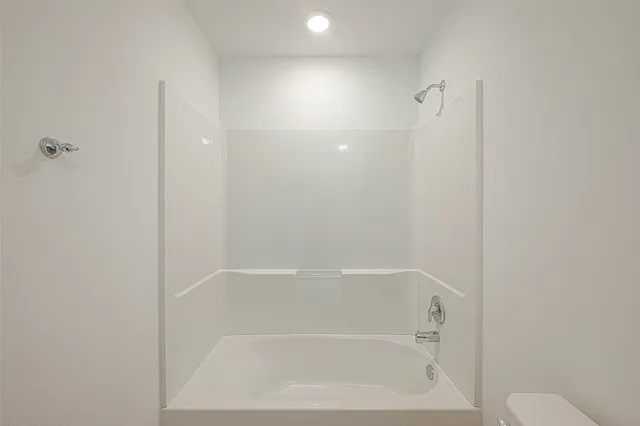 a bathroom with a sink toilet and a mirror