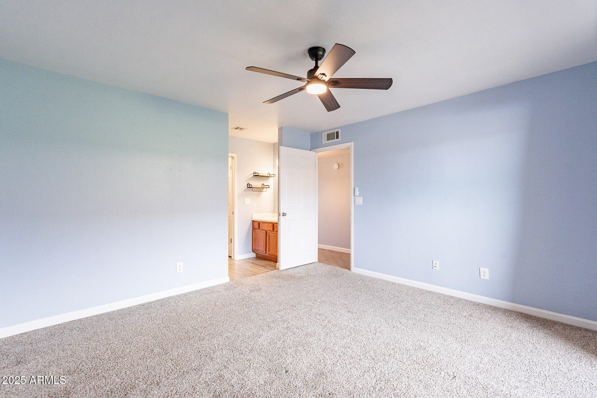 1402 East Guadalupe Road, Unit 207 Tempe, AZ 85283 - Photo 18 of 33 a view of empty room with a ceiling fan