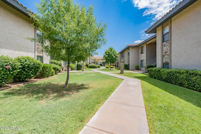 a view of a sitting area with furniture and garden