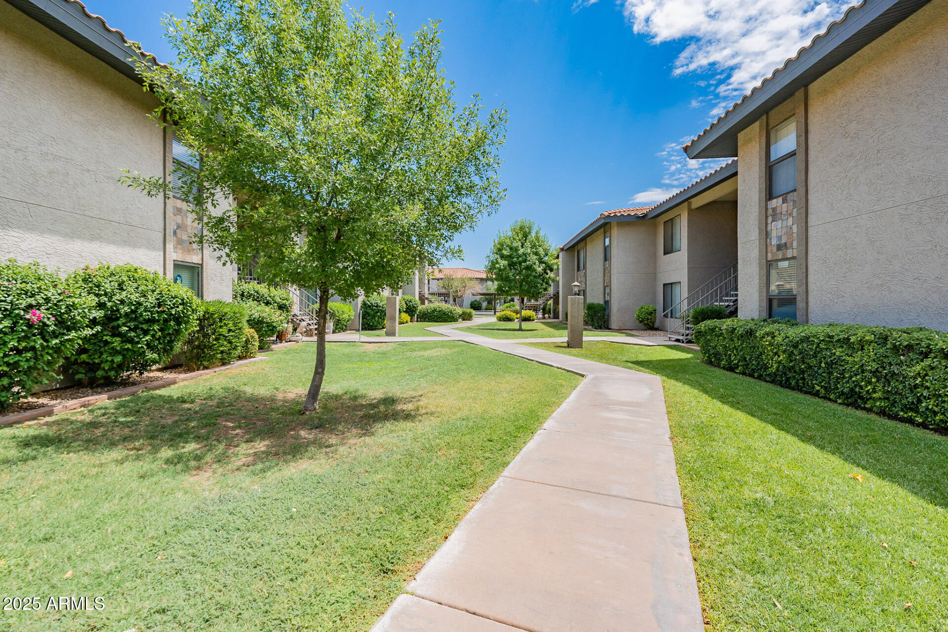 1402 East Guadalupe Road, Unit 207 Tempe, AZ 85283 - Photo 30 of 33 a pathway of a house with a yard