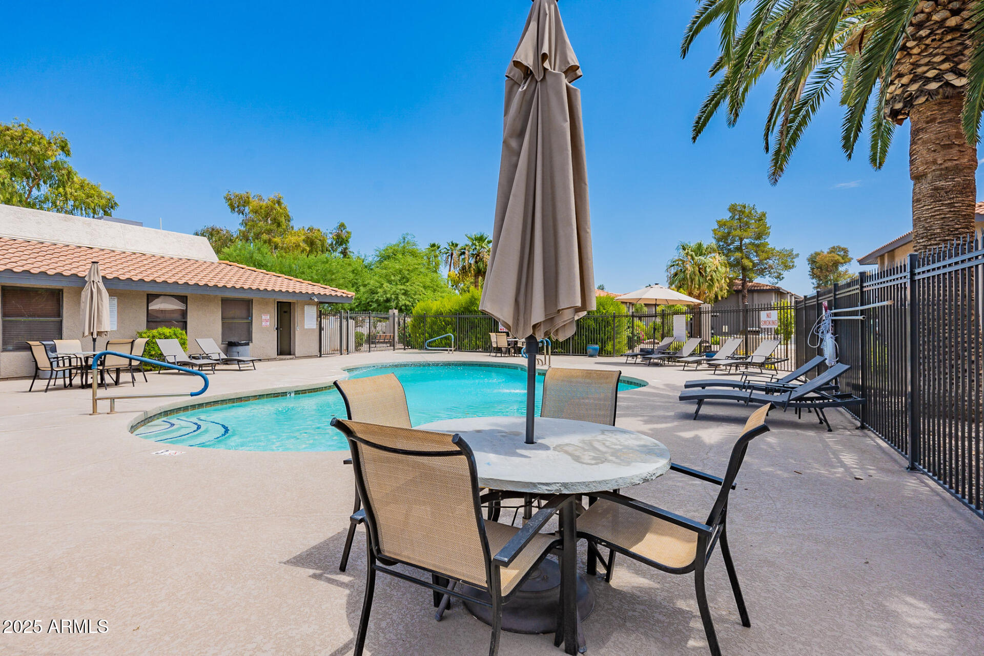 1402 East Guadalupe Road, Unit 207 Tempe, AZ 85283 - Photo 32 of 33 a view of a patio with table and chairs and potted plants
