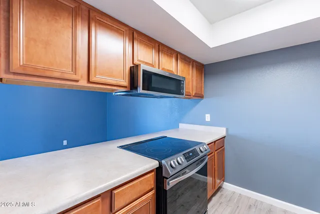 a kitchen with a stove and a microwave