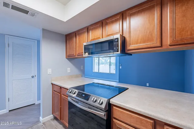 a kitchen with a stove and a microwave