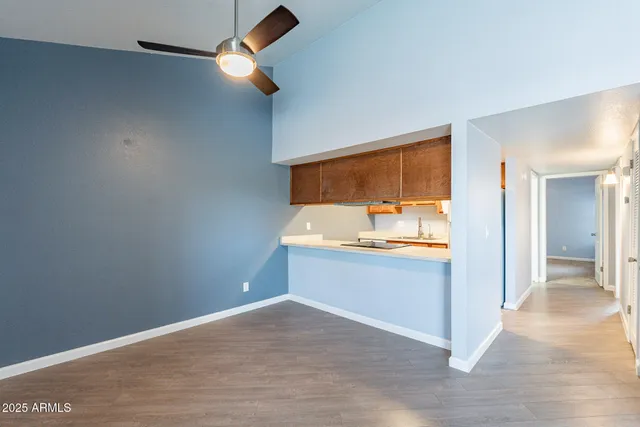 a view of a kitchen and a sink dishwasher and wooden floor