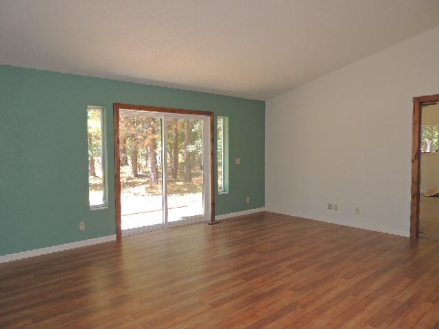 Living room has cathedral ceiling