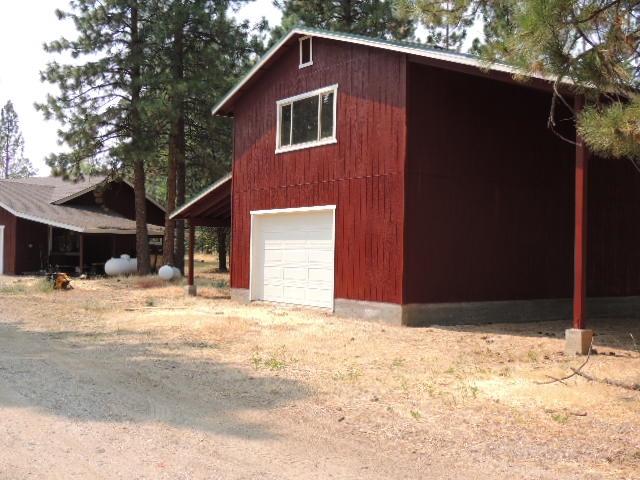 27032 Walker Road Fall River Mills, CA 96028 - Photo 8 of 13 Lots of coverd parking along shop