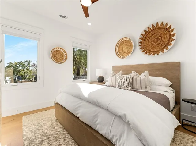 a bedroom with a bed and a window