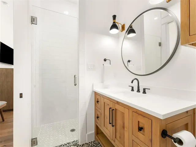 a bathroom with a sink and a mirror