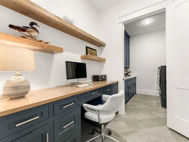a kitchen with a sink cabinets and appliances