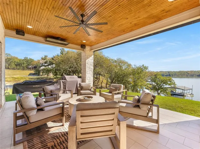 a view of a patio with couches chairs dining table and chairs