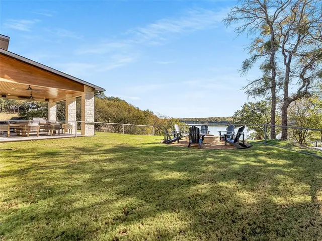 a view of a big yard with a house