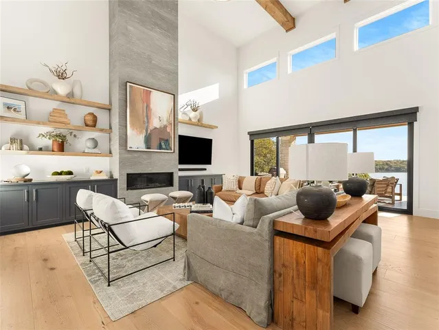 a living room with furniture fireplace and a flat screen tv