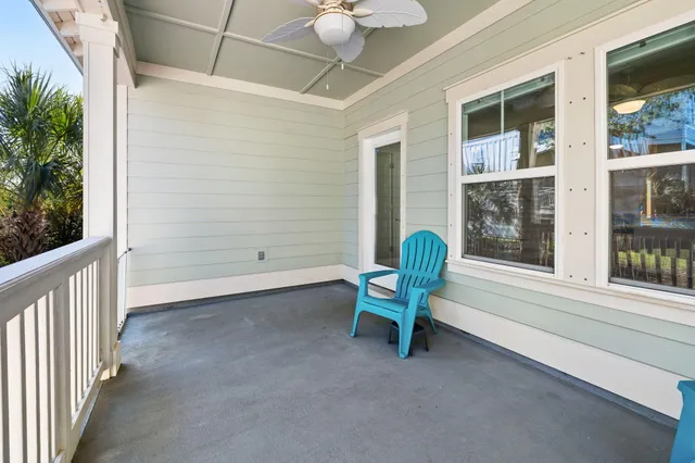 a kitchen with stainless steel appliances granite countertop a stove top oven a sink and white cabinets with wooden floor