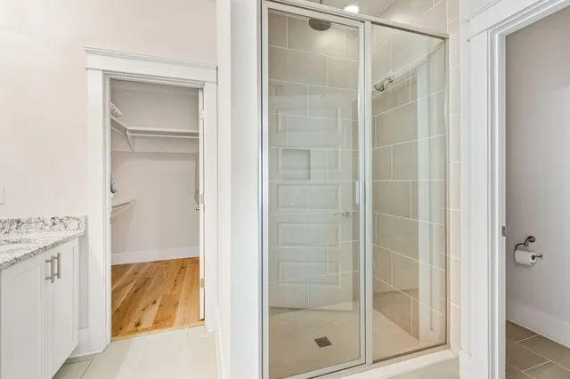a bathroom with a granite countertop sink mirror and