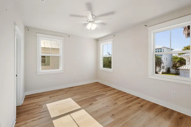a view of a kitchen with wooden floor and a kitchen space