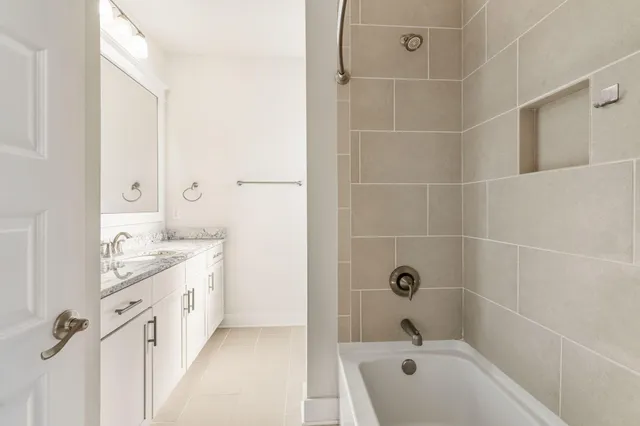 an empty room with wooden floor and window