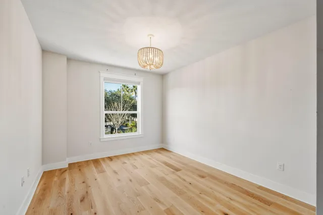 a bathroom with a sink toilet vanity and shower