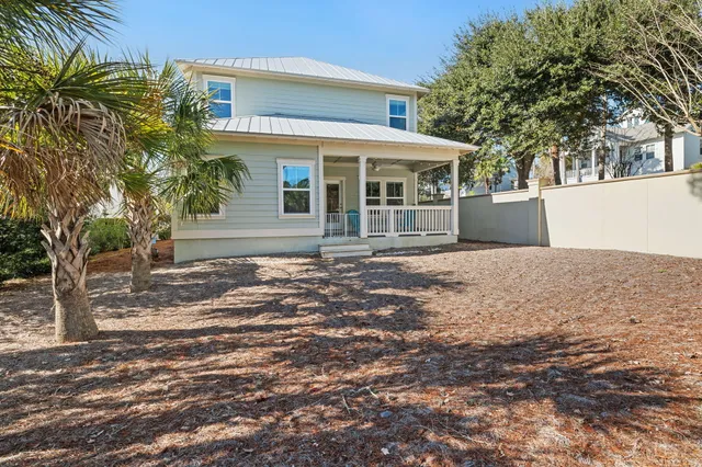 a view of two chair in a room with a window