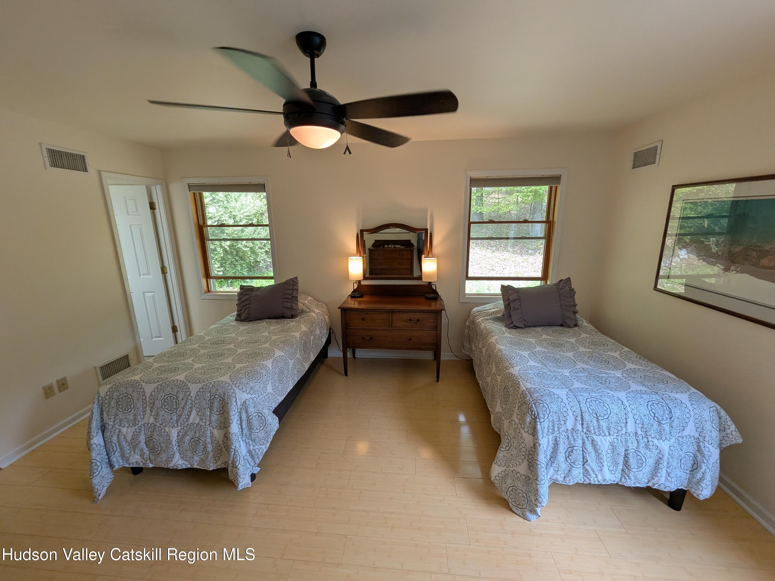 513 South Mountain Road Gardiner, NY 12525 - Photo 19 of 63 a bedroom with a bed chandelier and window