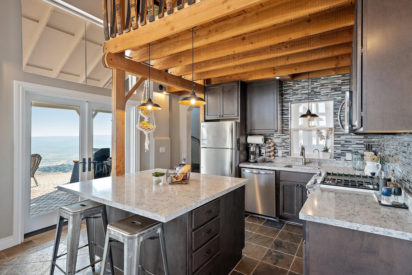16650 Finley Ridge Road Morgan Hill, CA 95037 - Photo 16 of 85 a kitchen with a sink a stove and chairs